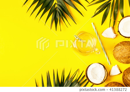 Coconut water and coconuts on a pastel background. Coconut water and coconuts on a pastel background. 41388272