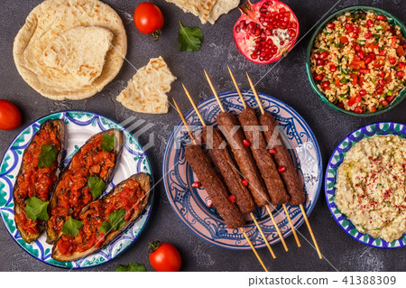 Classic kebabs, tabbouleh salad, baba ganush  41388309