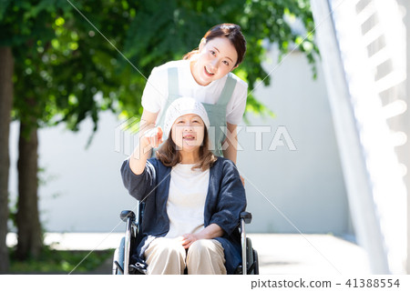 Care wheel chair woman Care wheel chair woman 41388554