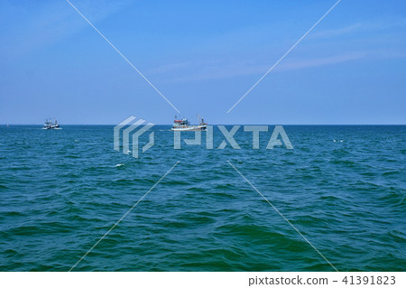 Fishing trawler on the water and blue sky,  41391823