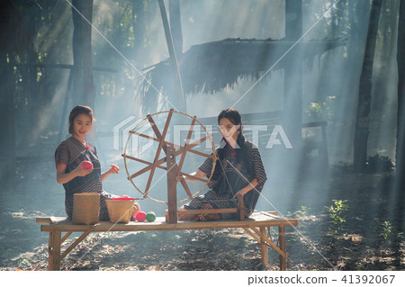 Two Beautiful Thai women smile in karen suit  41392067