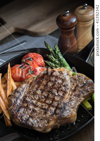 grilled rib eye steak on pan grilled rib eye steak on pan 41392342