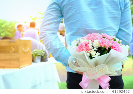 Valentines day. Man hiding behind a bouquet Valentines day. Man hiding behind a bouquet 41392492