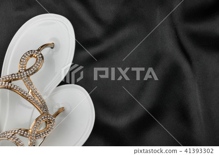 White flip flops decorated with rhinestones White flip flops decorated with rhinestones 41393302