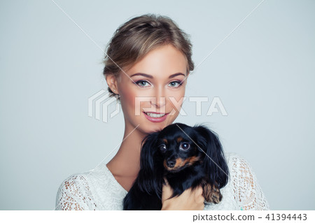 Young Woman Hugging Small Dog, Portrait Young Woman Hugging Small Dog, Portrait 41394443
