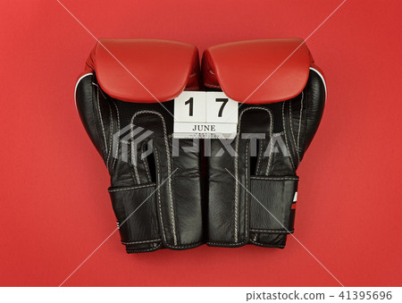 Black boxing gloves calendar with number 17 June 41395696