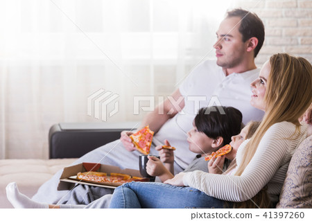 Family watching TV Family watching TV 41397260