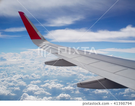 crop view of a white silver metallic airplane wing crop view of a white silver metallic airplane wing 41398794