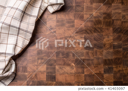 Top of view checkered tablecloth on wooden board. 41403097