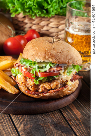 Chickenburger with bacon, tomato and cheese 41404694