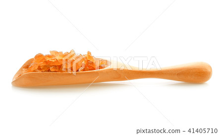 Rock sugar in wood scoop on white background Rock sugar in wood scoop on white background 41405710