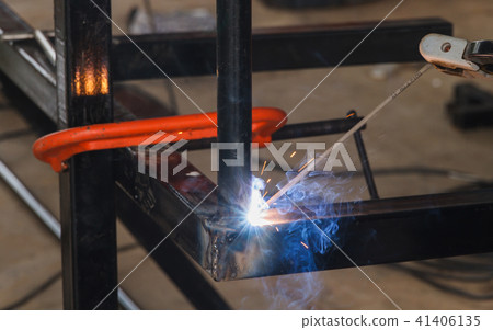 Shield metal arc welding welding and C-clamp. Shield metal arc welding welding and C-clamp. 41406135