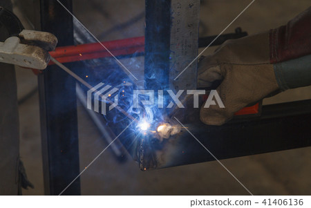Shield metal arc welding welding and C-clamp. Shield metal arc welding welding and C-clamp. 41406136