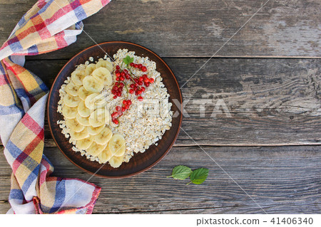 Oatmeal on an old wooden background.   41406340