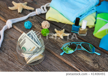 Dollars in glass jar.   41406491