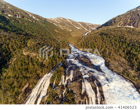 Photo of Rapid Stunning Waterfall in Husedalen Valley, Norway. Aerial view. Summer time. Photo of Rapid Stunning Waterfall in Husedalen Valley, Norway. Aerial view. Summer time. 41406523