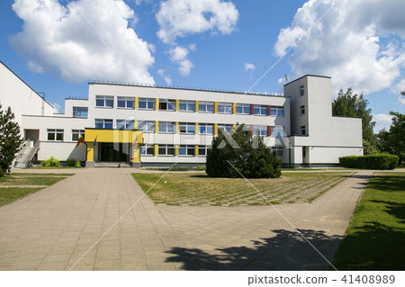 Public school building. Exterior view of school building with playground. Public school building. Exterior view of school building with playground. 41408989