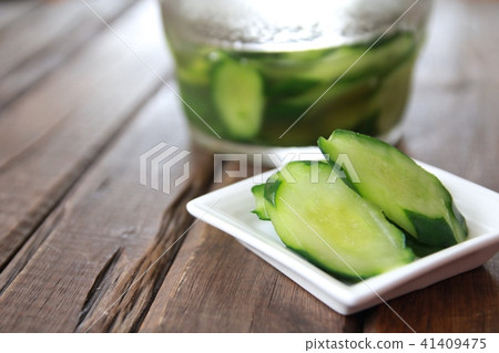 Lightly pickled cucumbers made in a glass pickle maker Lightly pickled cucumbers made in a glass pickle maker 41409475