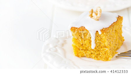 Homemade walnut carrot cake with icing cream. 41412333
