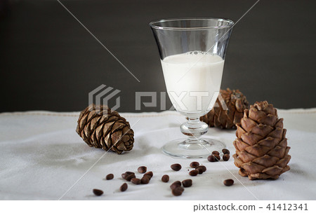 Glass Pine nuts vegan milk and cedar cones. Glass Pine nuts vegan milk and cedar cones. 41412341