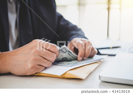 Money in human hands form of dollar bills, Businessman is counti Money in human hands form of dollar bills, Businessman is counti 41413019