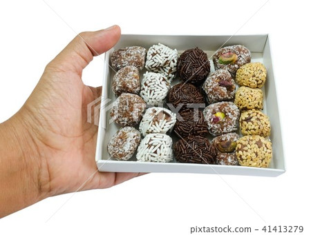 Hand Holding Box of Round Chocolate Candies Hand Holding Box of Round Chocolate Candies 41413279