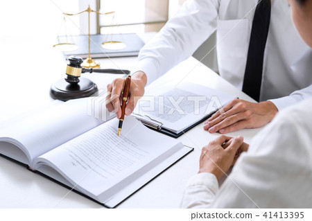 Businesspeople or lawyer having team meeting discussing agreemen 41413395