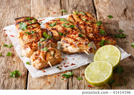 spicy grilled chicken kebab marinated in yoghurt spicy grilled chicken kebab marinated in yoghurt 41414396