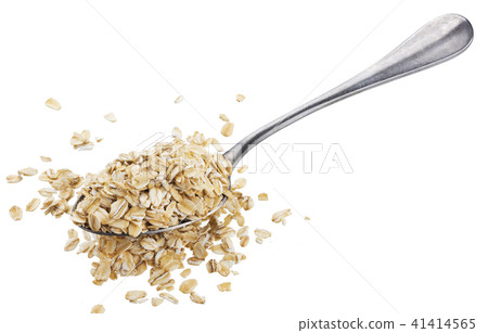 Oat flakes in spoon isolated on white background Oat flakes in spoon isolated on white background 41414565