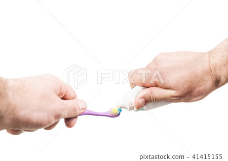 Extrusion of toothpaste on toothbrush Extrusion of toothpaste on toothbrush 41415155