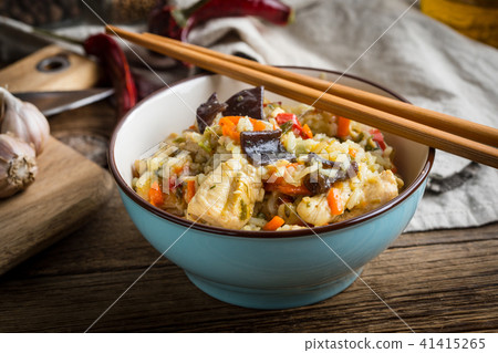 Risotto with chicken and vegetables. Risotto with chicken and vegetables. 41415265
