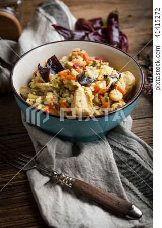 Risotto with chicken and vegetables. Risotto with chicken and vegetables. 41415272