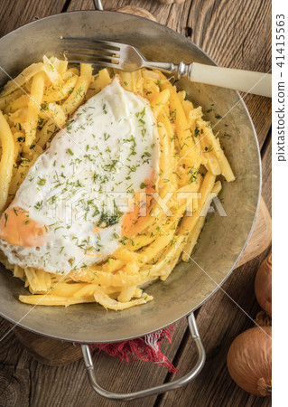Fried egg served with yellow beans. Fried egg served with yellow beans. 41415563