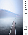 Aerial view of wooden pier at sea shore 41416338
