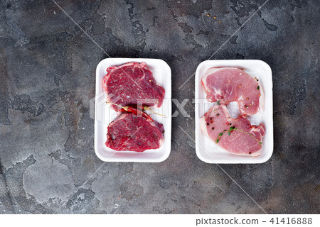 Supermarket packaged porterhouse steaks in styrofoam packaging tray 41416888