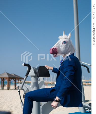 Strange guy in elegant suit and comical mask Strange guy in elegant suit and comical mask 41419739