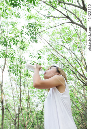 Portrait of young beautiful woman wearing white Portrait of young beautiful woman wearing white 41422320