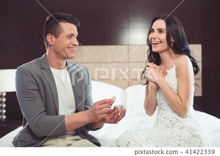 Glad guy offering hand of her loving girlfriend Glad guy offering hand of her loving girlfriend 41422339