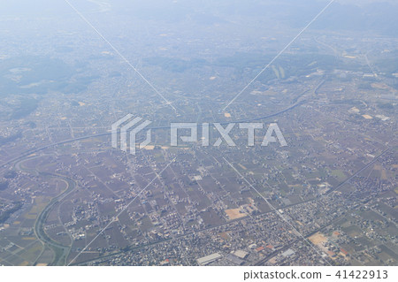 Aerial view of plane window looking down japan Aerial view of plane window looking down japan 41422913