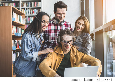 Positive men and girls using gadget Positive men and girls using gadget 41423371