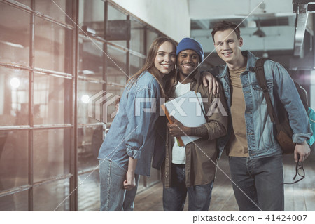 Overjoyed young coworkers are showing positivenesse Overjoyed young coworkers are showing positivenesse 41424007