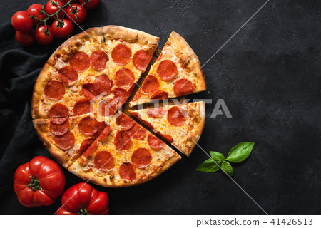 Pepperoni pizza on black concrete background 41426513