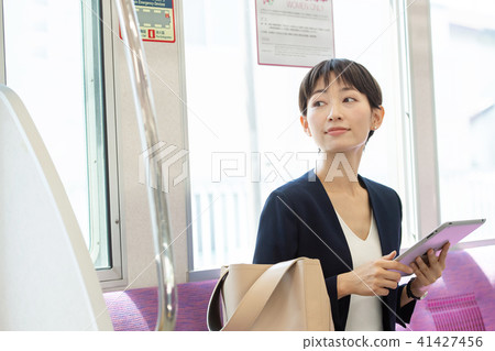 Commercial woman train commuting photography cooperation: Keio Electric Railway Co., Ltd. Commercial woman train commuting photography cooperation: Keio Electric Railway Co., Ltd. 41427456