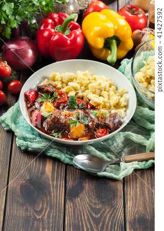 Hungarian beef goulash serwed with galuska noodles Hungarian beef goulash serwed with galuska noodles 41427592