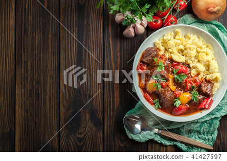 Hungarian beef goulash serwed with galuska noodles Hungarian beef goulash serwed with galuska noodles 41427597