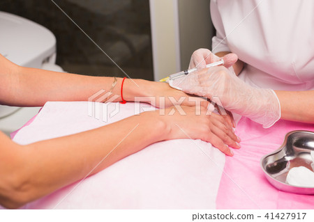 cosmetology and beauty concept - Anti-age injection therapy, hand rejuvenation cosmetology and beauty concept - Anti-age injection therapy, hand rejuvenation 41427917
