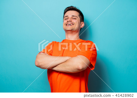 Young handsome man in orange t-shirt 41428902