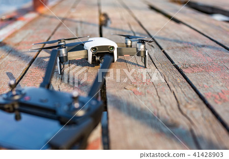Drone and control panel on an old board 41428903