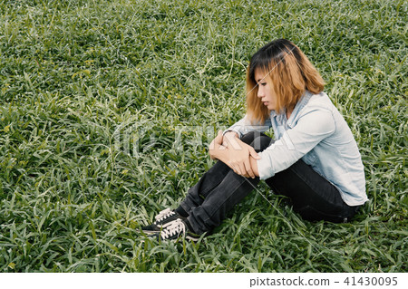 young hipster woman, sad, long-haired  sitting  41430095