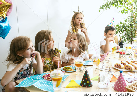 Girl birthday decorations. table setting with cakes, drinks and party gadgets. Girl birthday decorations. table setting with cakes, drinks and party gadgets. 41431986